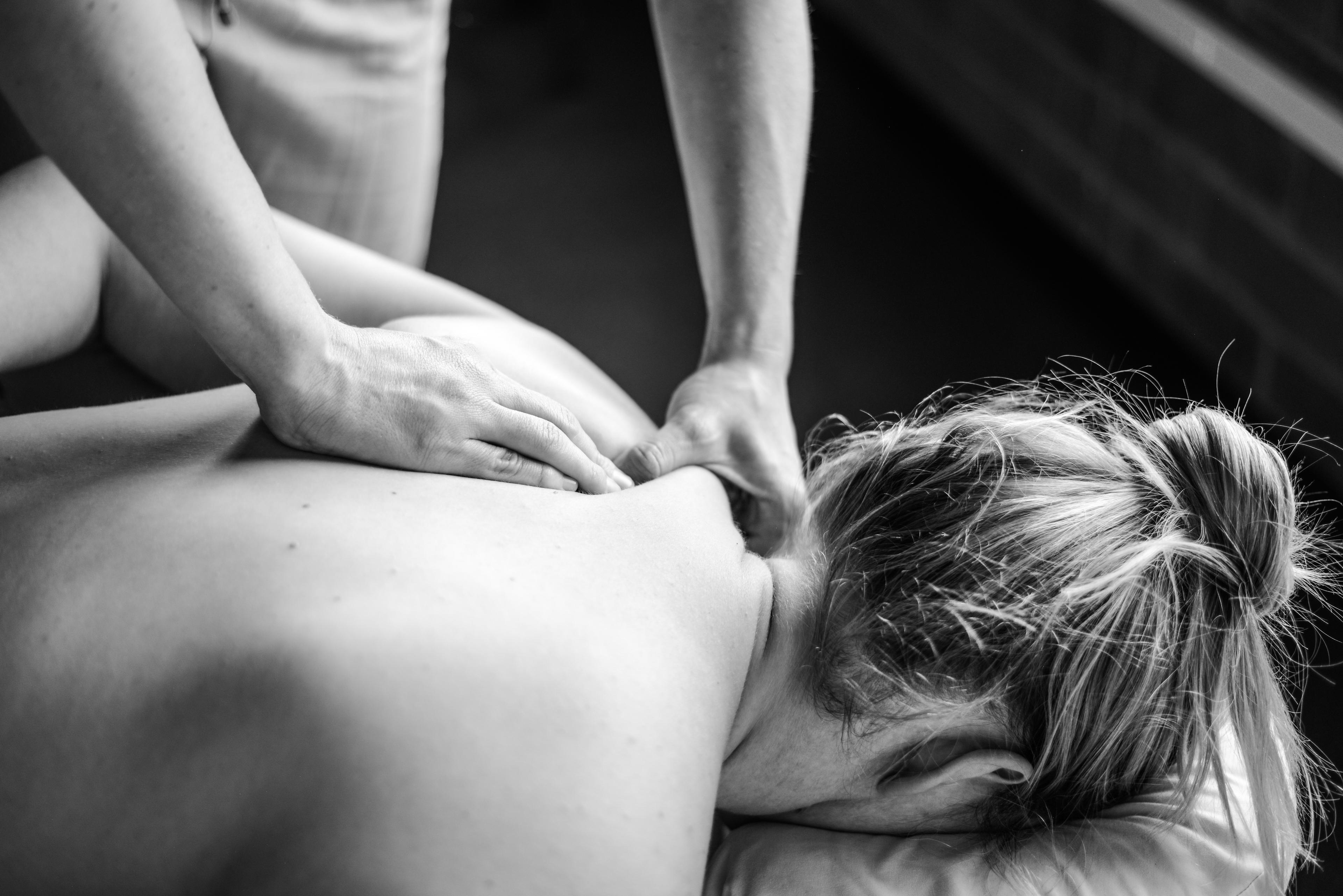 Person getting their shoulders massaged.